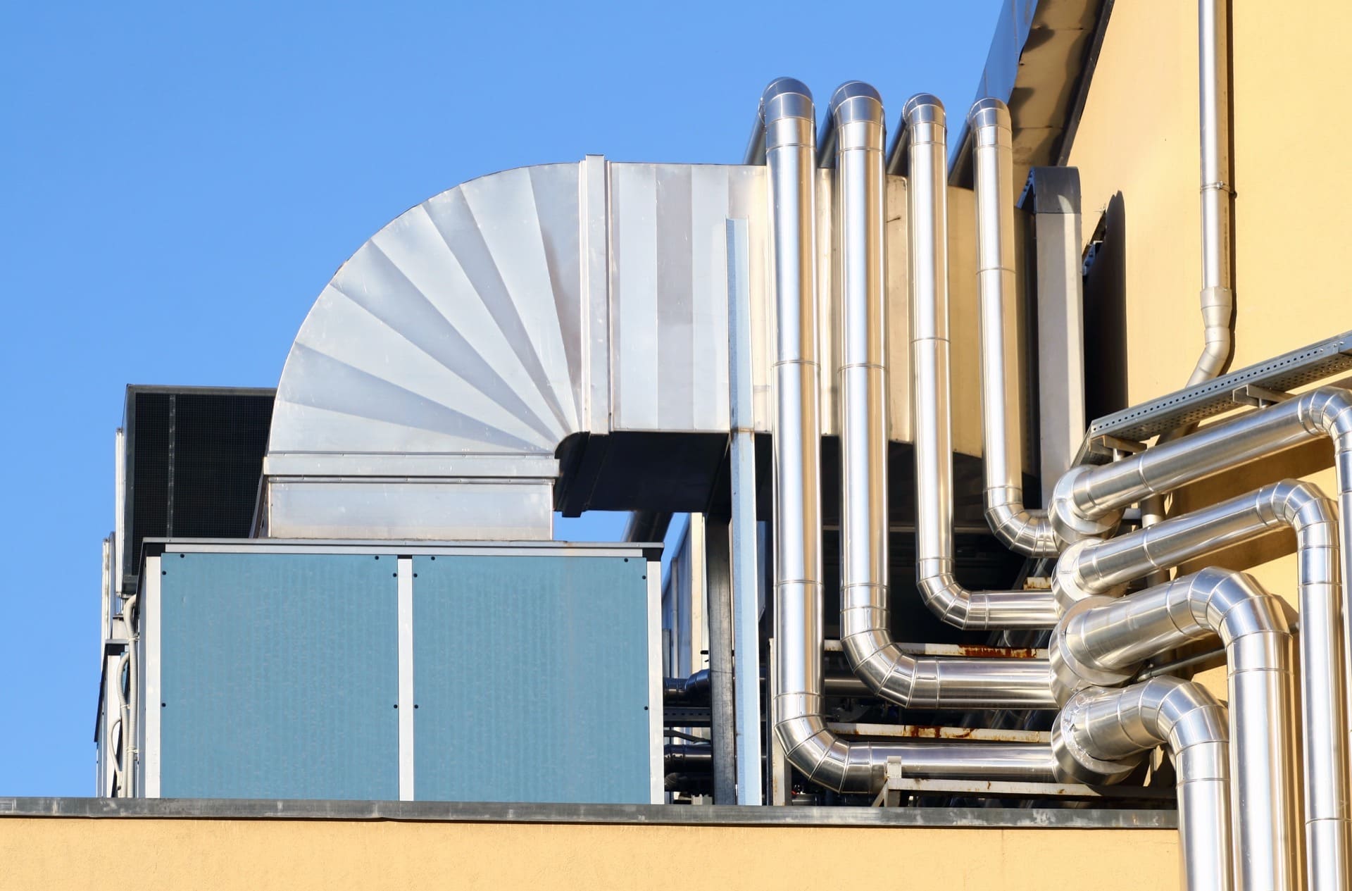 Rooftop HVAC System with Shiny Metal Pipes